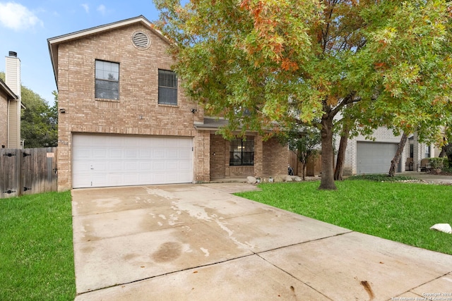 view of front facade featuring a front yard and a garage