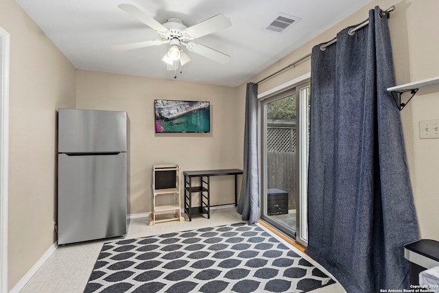 interior space with stainless steel fridge and ceiling fan