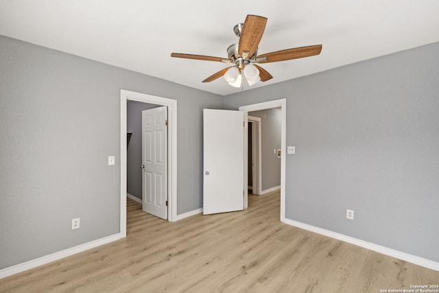 unfurnished bedroom with light hardwood / wood-style flooring and ceiling fan