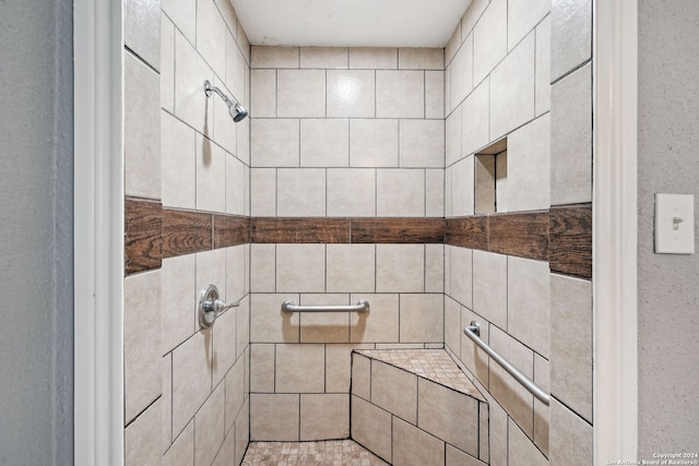 bathroom with tiled shower