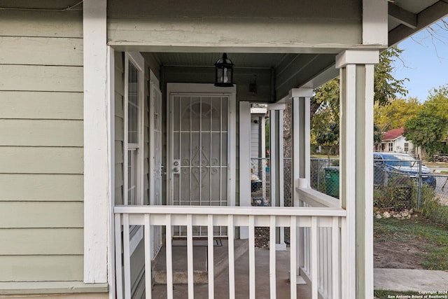 entrance to property featuring covered porch