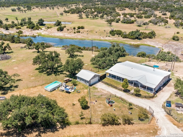 birds eye view of property featuring a water view and a rural view