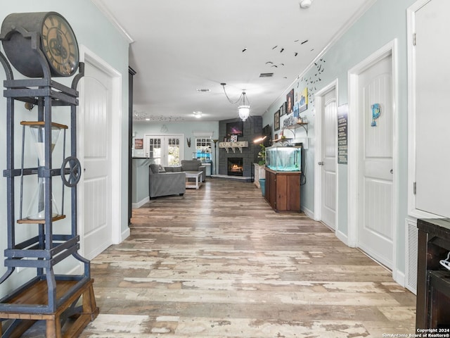 interior space featuring crown molding and hardwood / wood-style floors