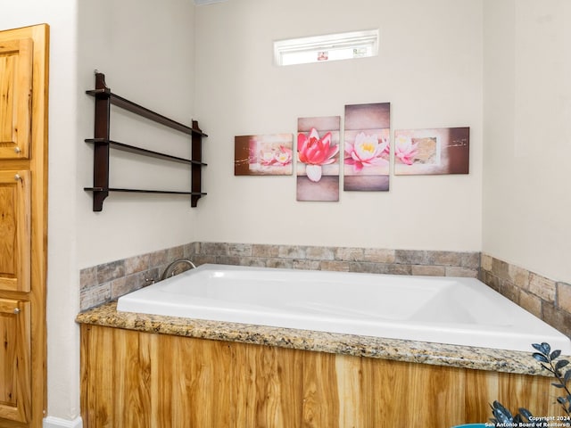 bathroom featuring a tub to relax in