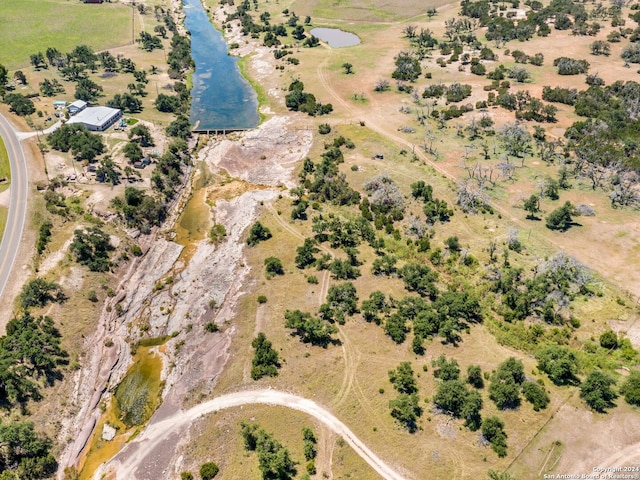 birds eye view of property with a rural view and a water view