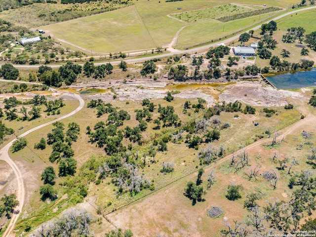 birds eye view of property with a rural view