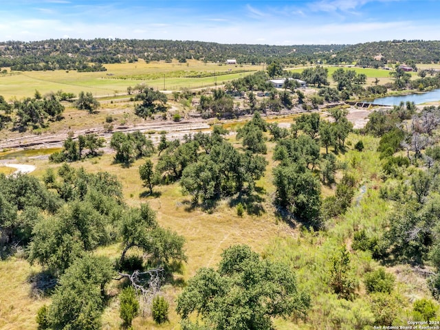 aerial view with a water view and a rural view