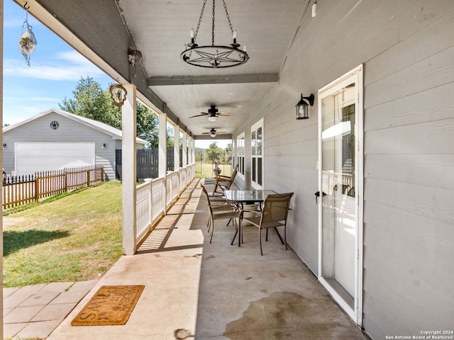 view of patio / terrace featuring a garage and an outdoor structure