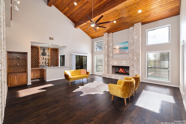 living room featuring a fireplace, high vaulted ceiling, and dark hardwood / wood-style floors