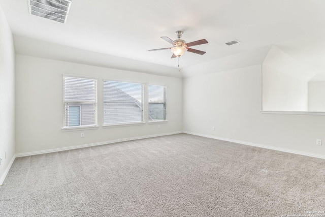 carpeted spare room with ceiling fan