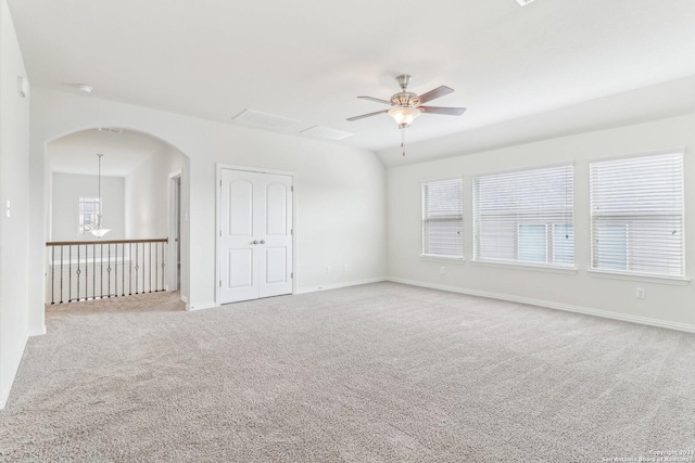 carpeted spare room with ceiling fan