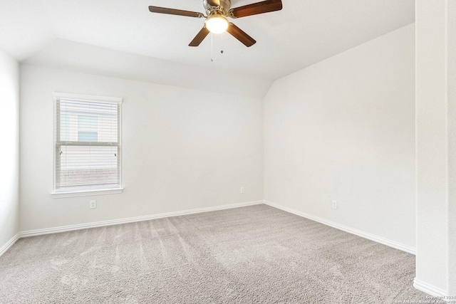 spare room with carpet flooring, ceiling fan, and lofted ceiling