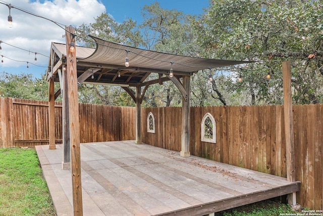 wooden terrace with a patio