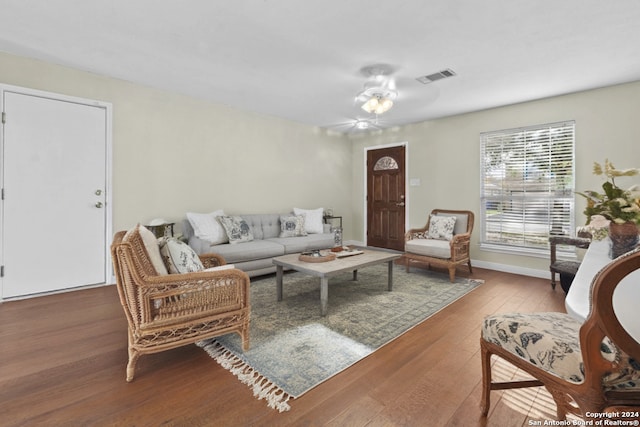 living room with hardwood / wood-style flooring and ceiling fan