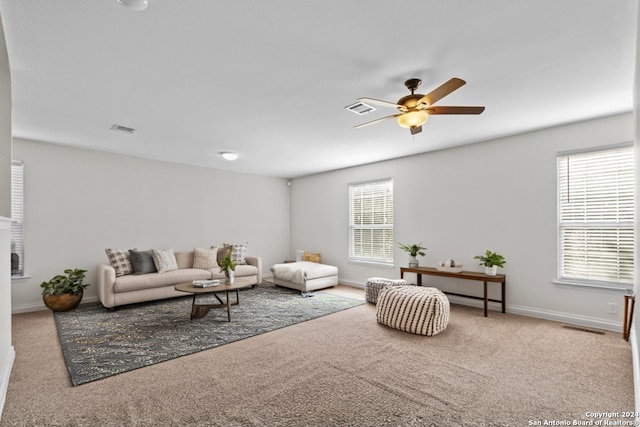 living room with carpet and ceiling fan