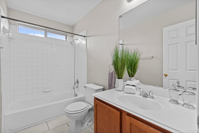 full bathroom featuring toilet, vanity, tile patterned floors, and tiled shower / bath combo