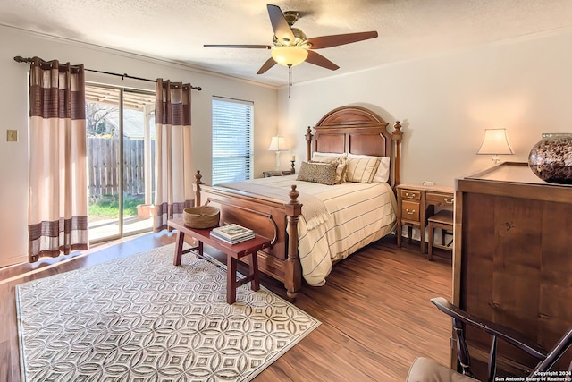 bedroom with access to exterior, ceiling fan, crown molding, light hardwood / wood-style floors, and a textured ceiling