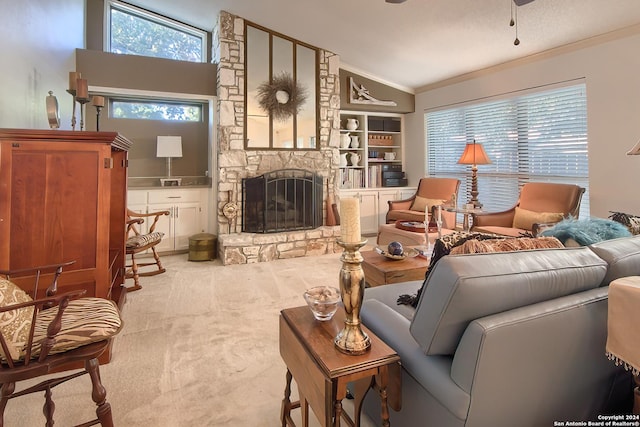 carpeted living room with ceiling fan, a fireplace, crown molding, and vaulted ceiling