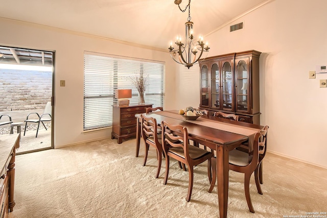 dining space with light carpet, lofted ceiling, and an inviting chandelier