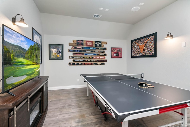 playroom with hardwood / wood-style floors and lofted ceiling