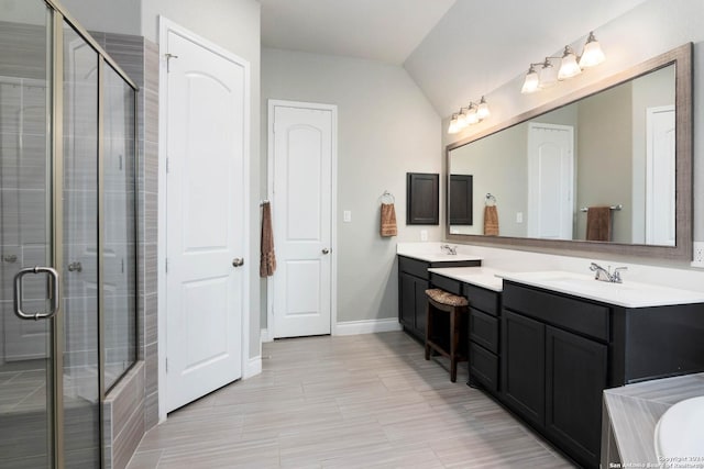 bathroom with vanity, lofted ceiling, and shower with separate bathtub