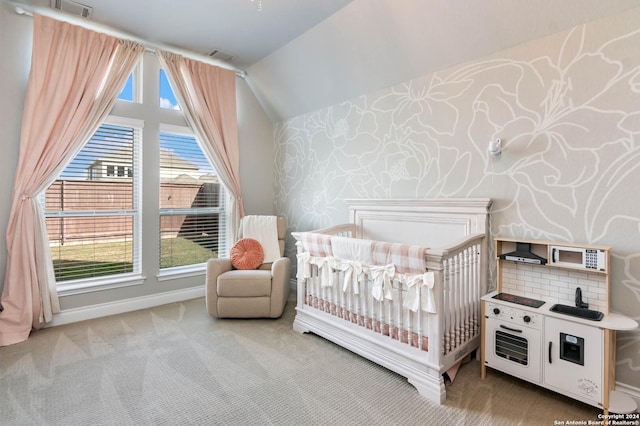 carpeted bedroom with multiple windows and a nursery area