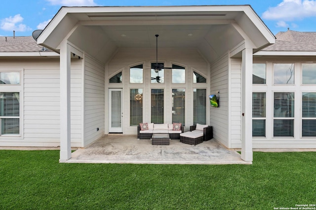 exterior space featuring outdoor lounge area, a patio area, and a lawn