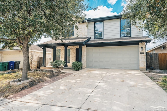 7427 Vega Gap, San Antonio, TX 78252 - traditional home with stone siding, a garage, and concrete driveway