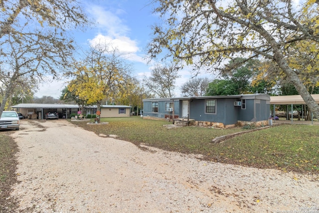 view of front of home featuring a front yard and a carport