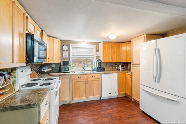 kitchen with dark hardwood / wood-style flooring, sink, white appliances, and light brown cabinets