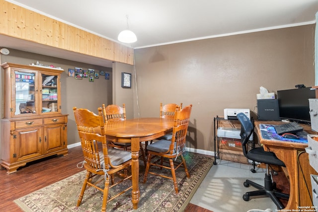 dining space featuring crown molding and dark hardwood / wood-style floors