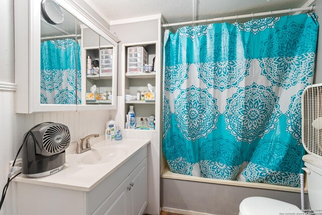 full bathroom with shower / bath combination with curtain, vanity, toilet, and crown molding