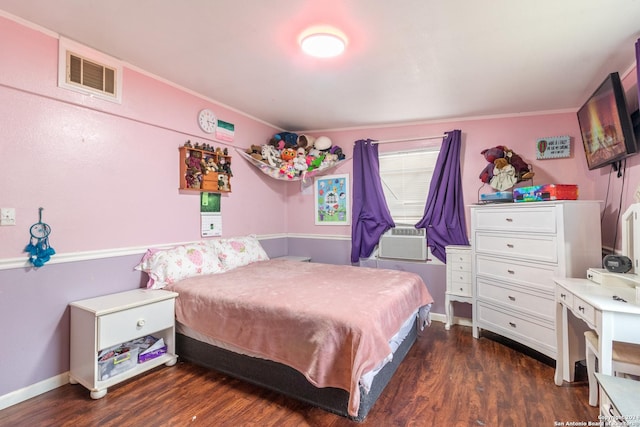 bedroom with crown molding, dark hardwood / wood-style flooring, and cooling unit