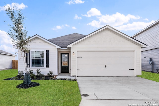 ranch-style home with a garage and a front yard