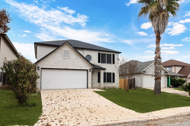 view of front property with a front lawn and a garage