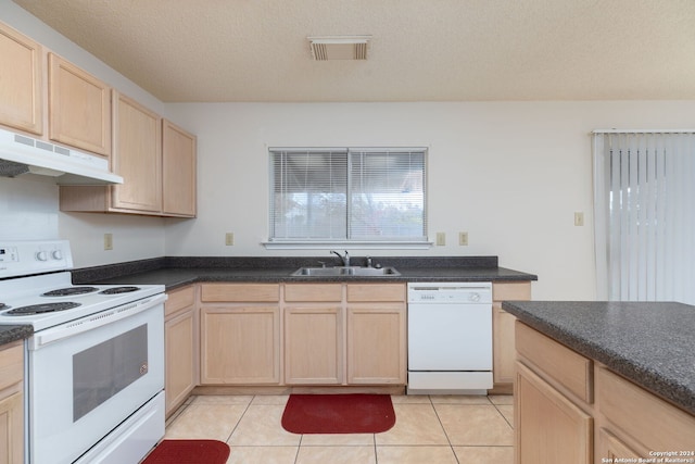 kitchen featuring sink, light brown cabinets, a textured ceiling, white appliances, and light tile patterned floors