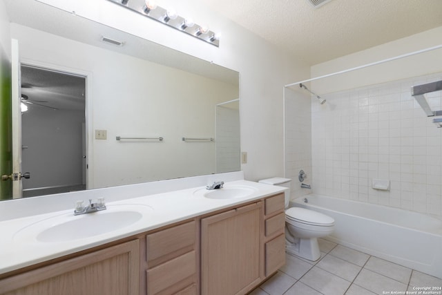 full bathroom featuring tile patterned floors, vanity, a textured ceiling, ceiling fan, and toilet