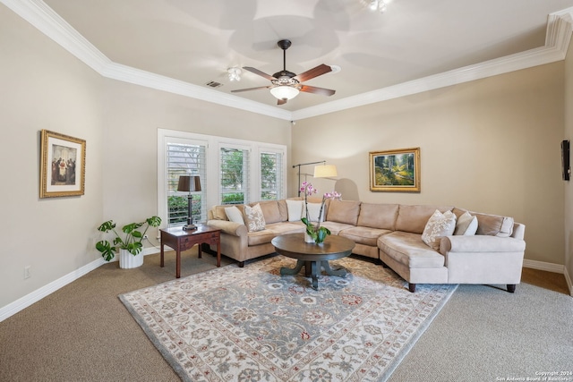 living room featuring ceiling fan, ornamental molding, and carpet