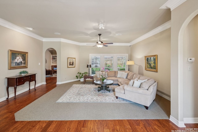 living room featuring ornamental molding, dark hardwood / wood-style floors, and ceiling fan