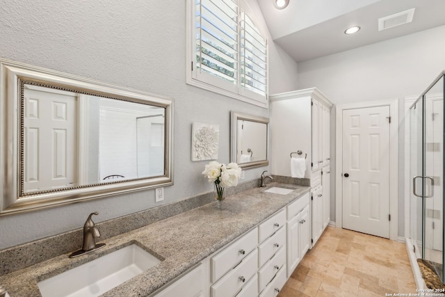 bathroom with vanity and an enclosed shower