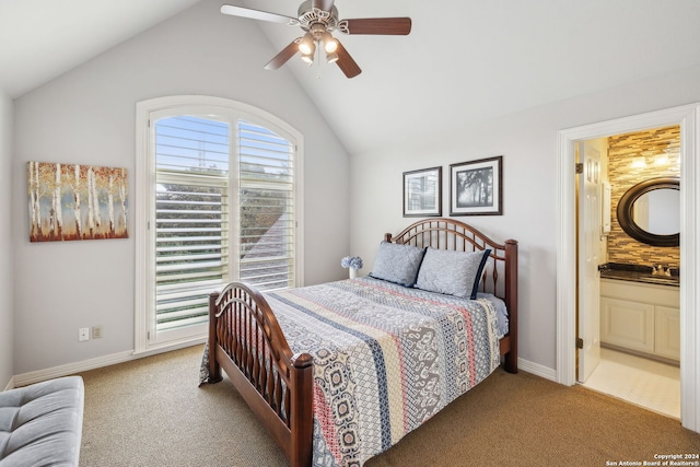 bedroom with lofted ceiling and light colored carpet