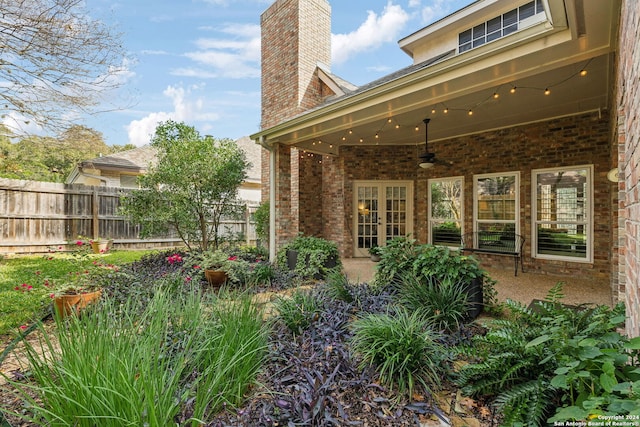 exterior space featuring ceiling fan