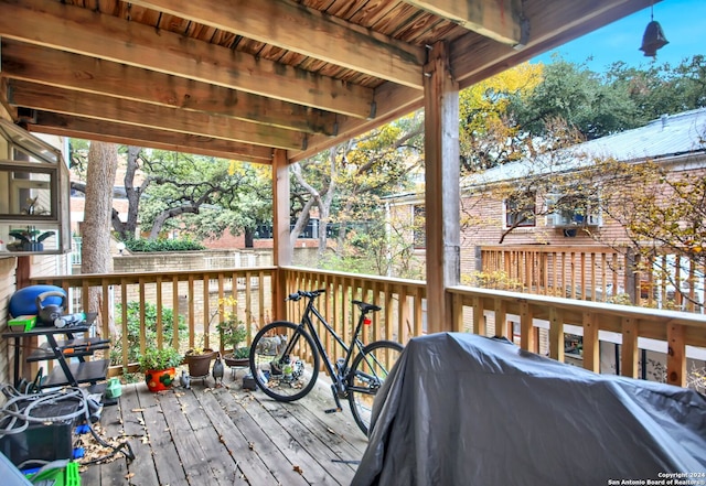 wooden terrace with grilling area