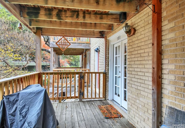 wooden deck featuring french doors