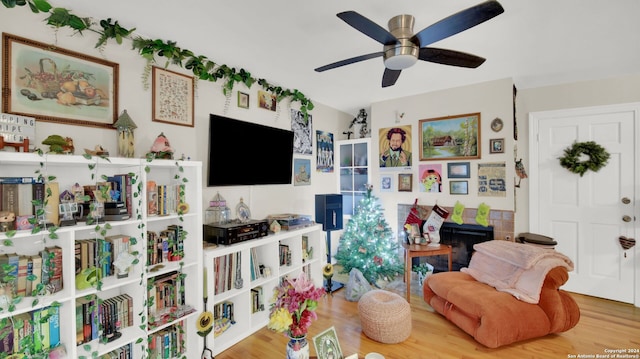 interior space with wood-type flooring and ceiling fan