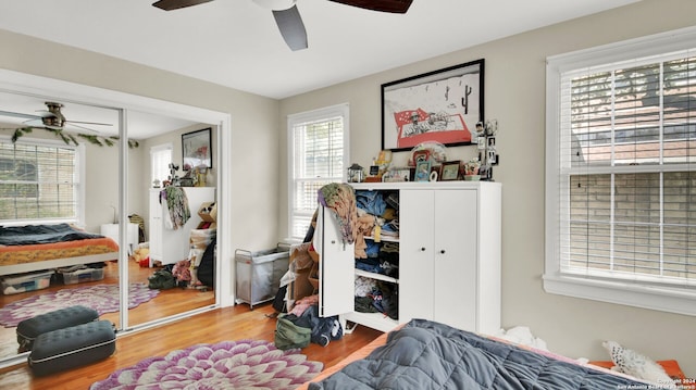 bedroom with hardwood / wood-style floors and ceiling fan