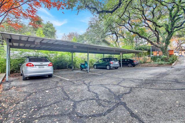 view of vehicle parking with a carport