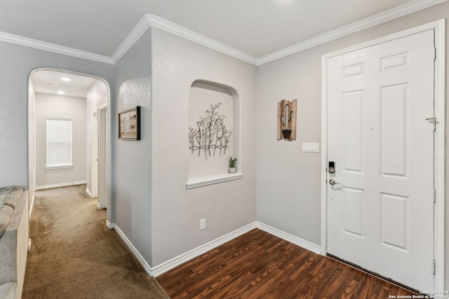 entrance foyer featuring dark hardwood / wood-style floors and ornamental molding