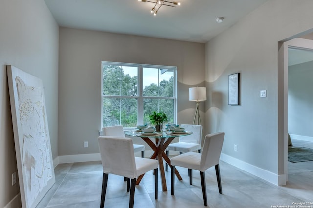 dining space featuring an inviting chandelier