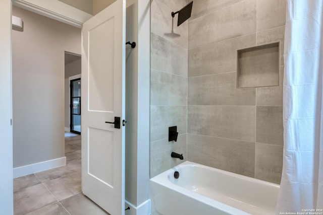 bathroom featuring tile patterned flooring and shower / tub combo with curtain